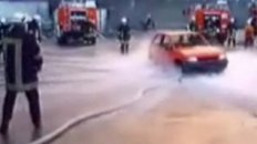 Firemen Lift Car With Hose Water